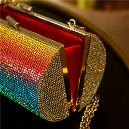 Get ready to stand out with our Rainbow Rhinestone Purse Evening Bag! Made with faux rubber diamonds and luxurious satin, this bag features bold rainbow colors that will surely make a statement. With a shoulder strap for easy carrying and a compact size of 10cm x 10cm x 17cm, this bag is perfect for those who like to take risks and add a touch of adventure to their style. Don't miss out on this daring and inspiring accessory!